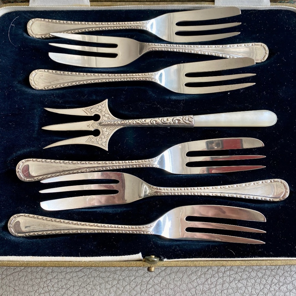 Sheffield Hallmarked Sterling silver cake fork set with trident